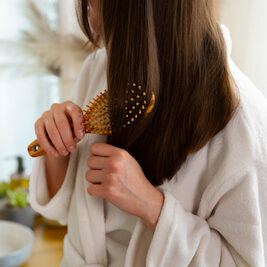 a women taking care of her hair